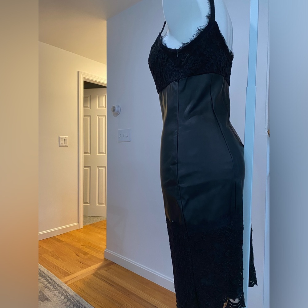 Black form fitting, sexy.  Lacy top and bottom.  Leather look.
